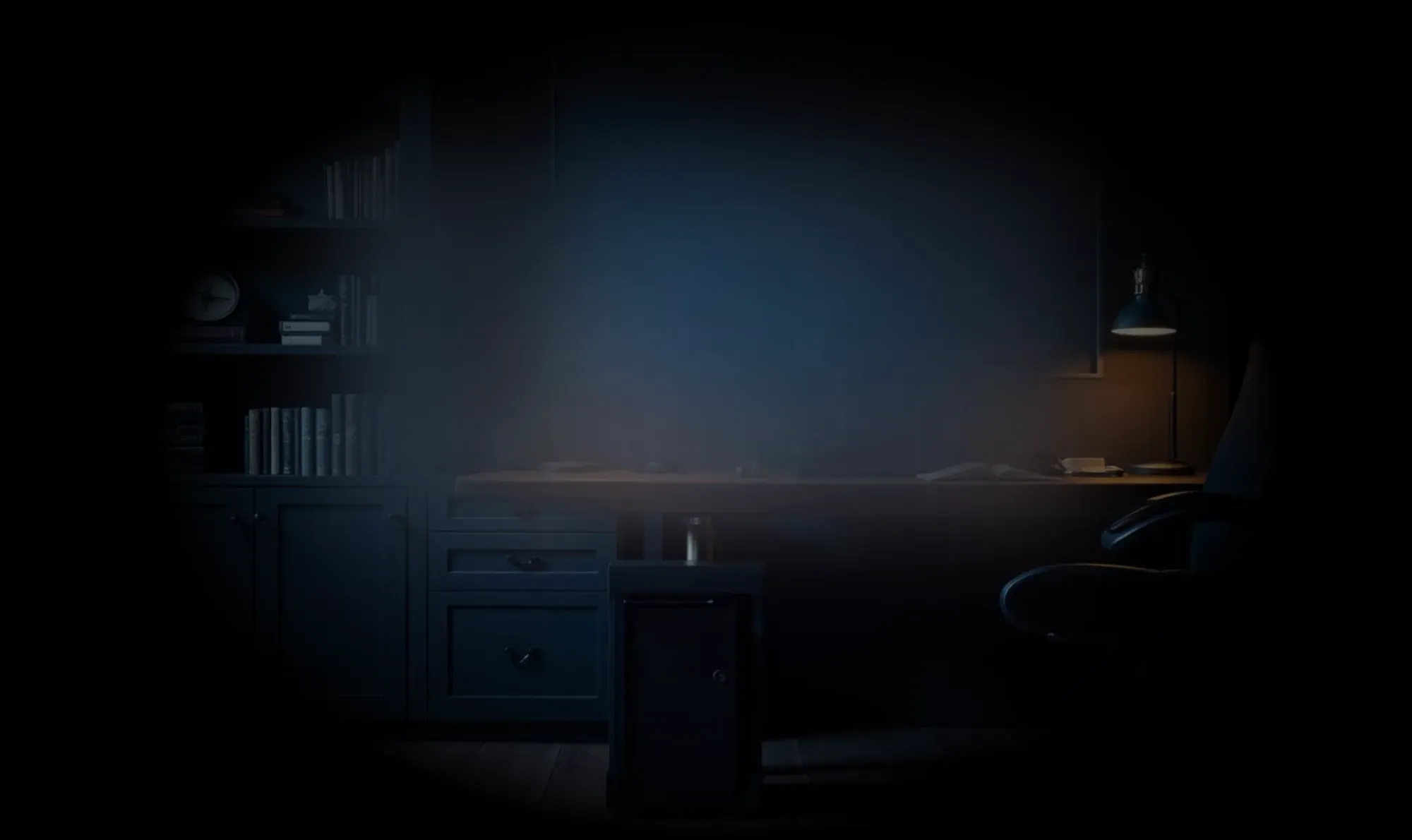 Dark home office with black bookshelves filled with books, a desk with a lamp, and a black swivel chair on wooden flooring.